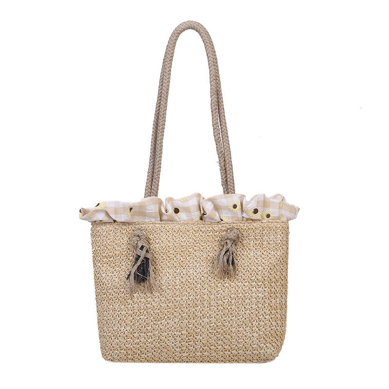 Women's summer straw bag tote in khaki, medium square shape with woven design and drawstring closure.