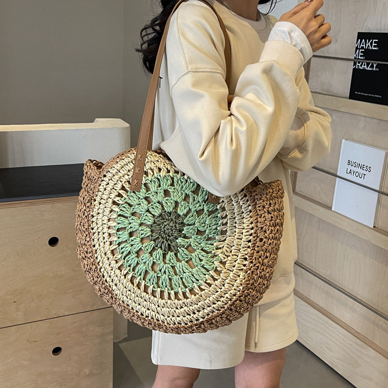 Color crochet round one shoulder straw bag with green and brown woven design, medium-soft hardness, polyester cotton lining, urban simplicity style.