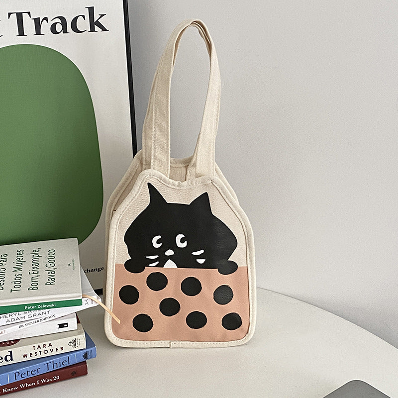 Casual hand-carrying canvas bag with cute kitten illustration in vertical square shape, fresh style.
