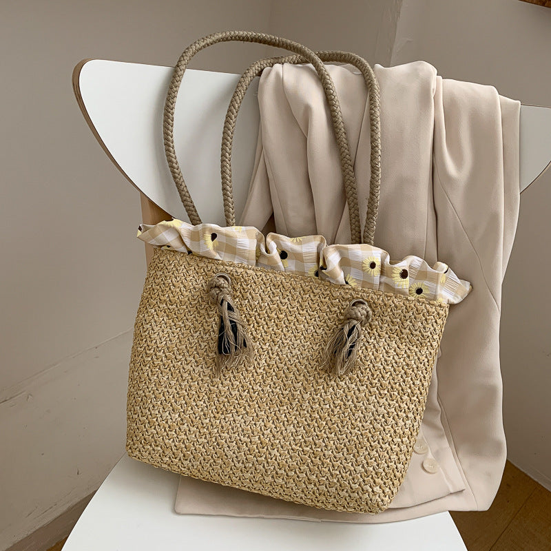 Fashion women's summer straw bag in a woven wicker design with drawstring, medium size, khaki color.