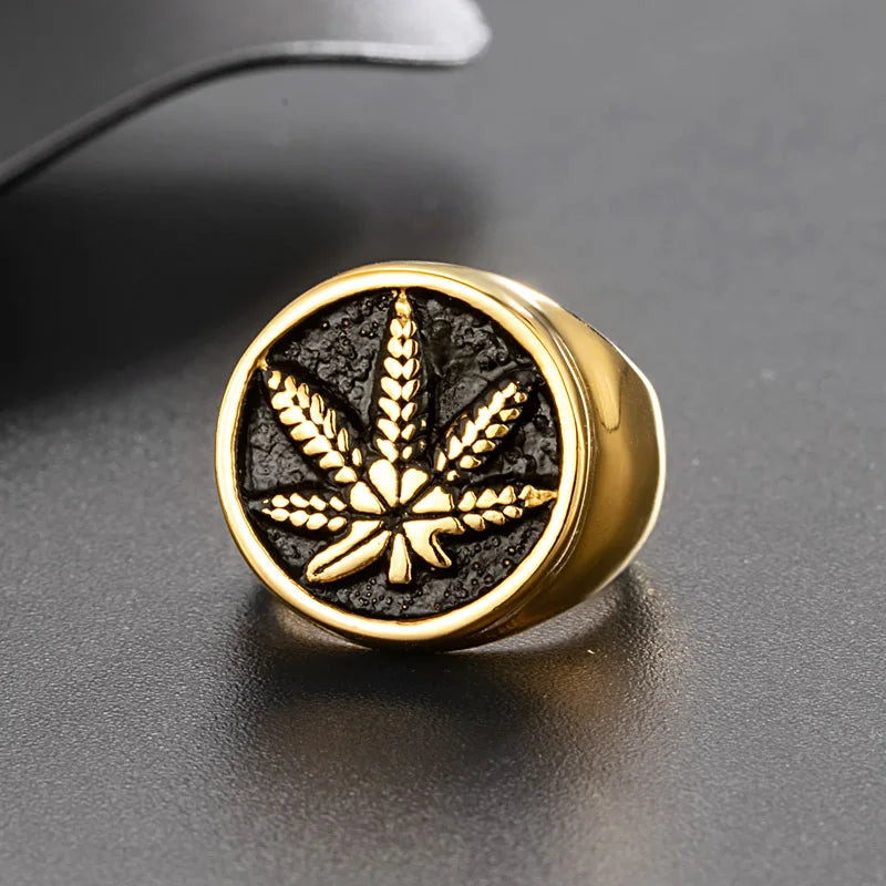 Stainless steel gold signet ring with weed hemp cannabis maple leaf design.