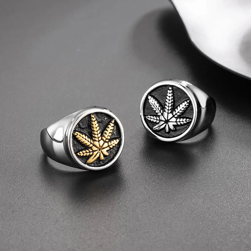 Stainless steel signet rings with gold and silver maple leaf design for men.