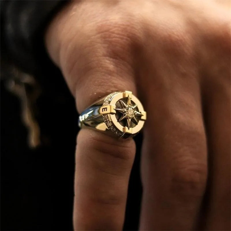 Gothic stainless steel gold color fidget ring on male hand, vintage Indian jewelry design.