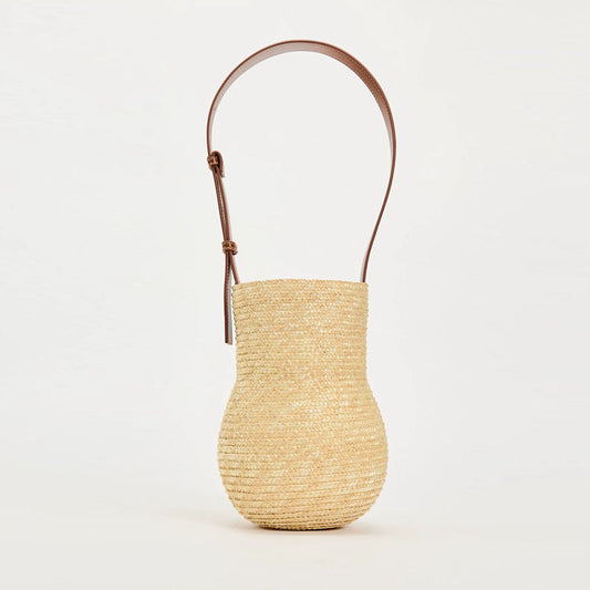 Gourd-shaped straw-weaved shoulder bag with leather strap, ideal for daily use.